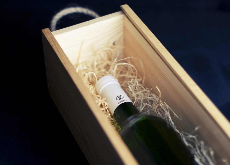 A bottle of wine in a box with a story about forgiveness and marriage.